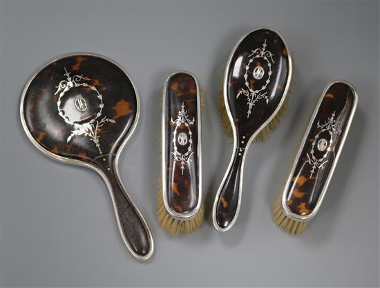 A George V silver and tortoiseshell four piece dressing table set, William Comyns & Sons, London, 1926.